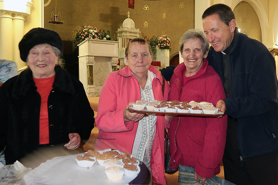 Fr Richard Hyland with parishioners who enjoyed a cuppa after the Papal Mass